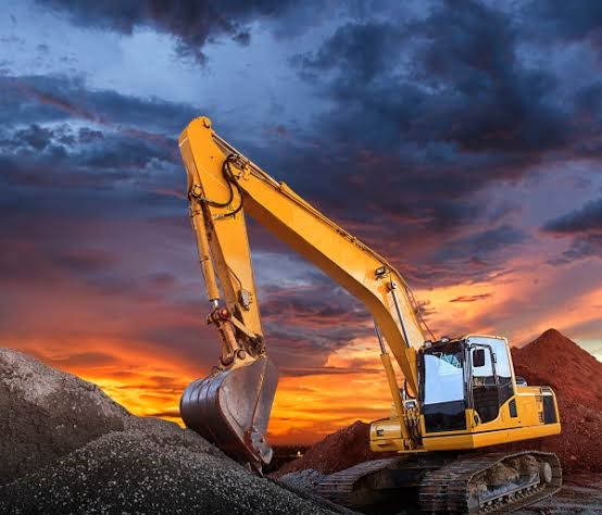 Excavator and hauler fleet deployed on a large industrial earthworks site